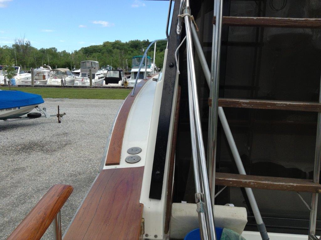 For comparison, the toe rail and cockpit teak was painted brown like the flybridge ladder before